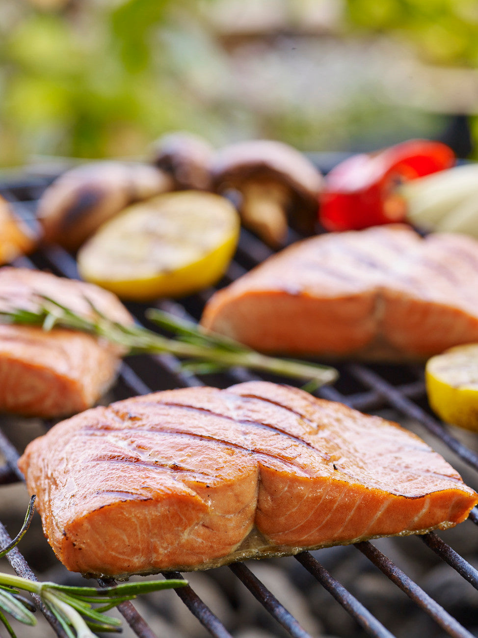 Photo of salmon and veggies on a grill